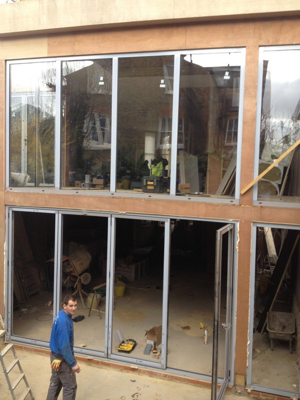 Aluminium bi-fold doors with two-storey glazing in Catford