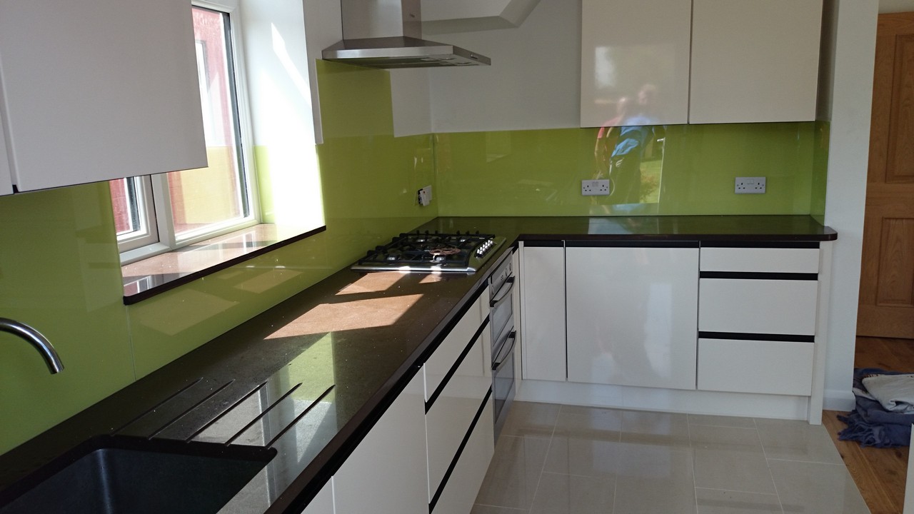 Lime green glass kitchen splashback installed by Catford glaziers