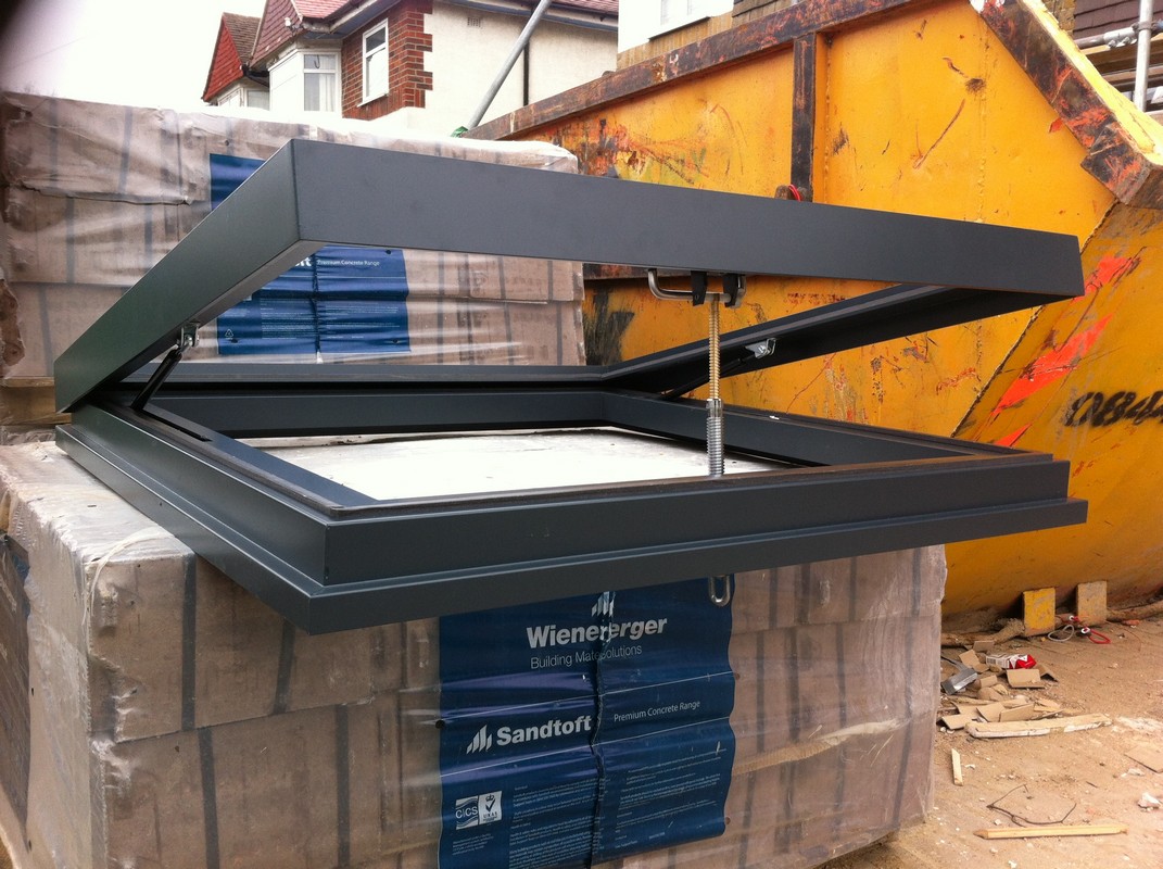 Opening flat roof skylight in anthracite grey installed in Catford