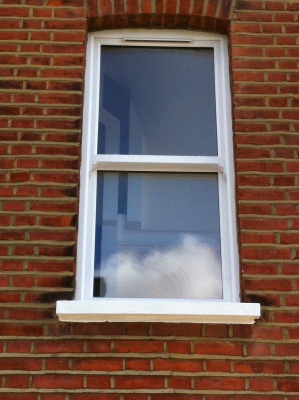 uPVC sash window on Victorian red brick house in Catford